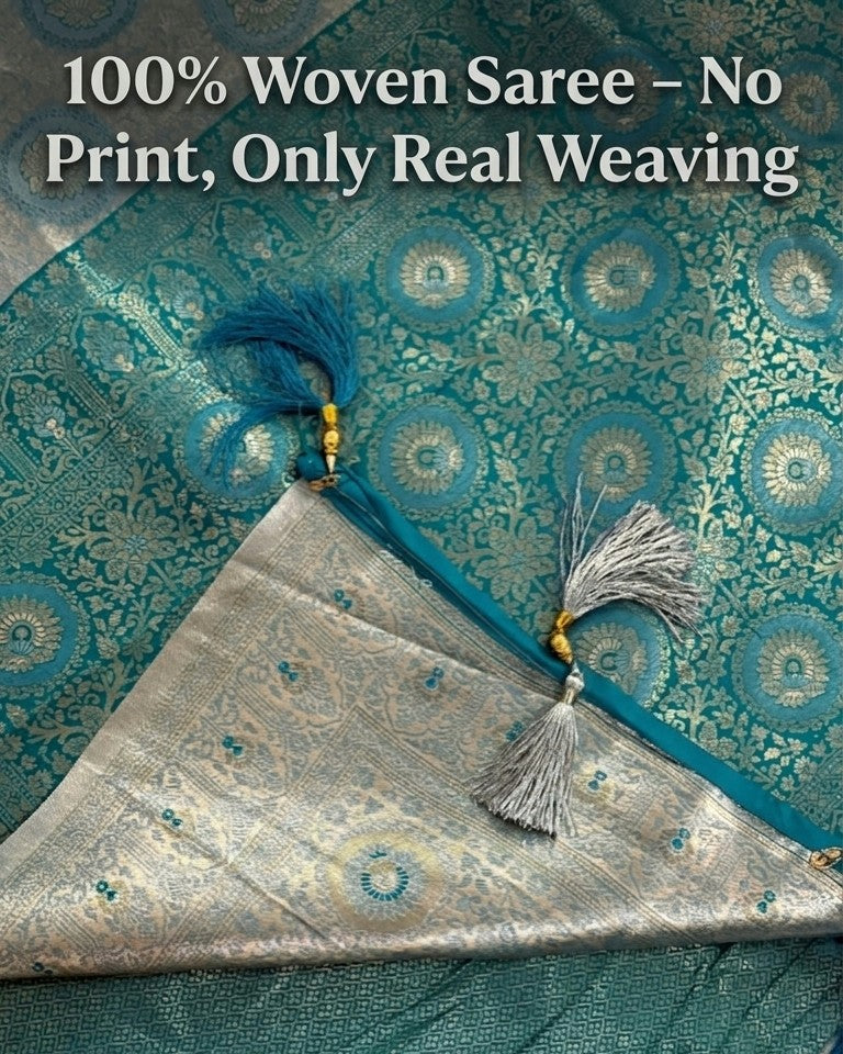 Woven saree with decorative tassels on a matching fabric background, emphasizing '100% Woven Saree - No Print, Only Real Weaving'.