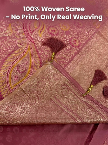 Pink woven saree with tassels and text '100% Woven Saree - No Print, Only Real Weaving'.