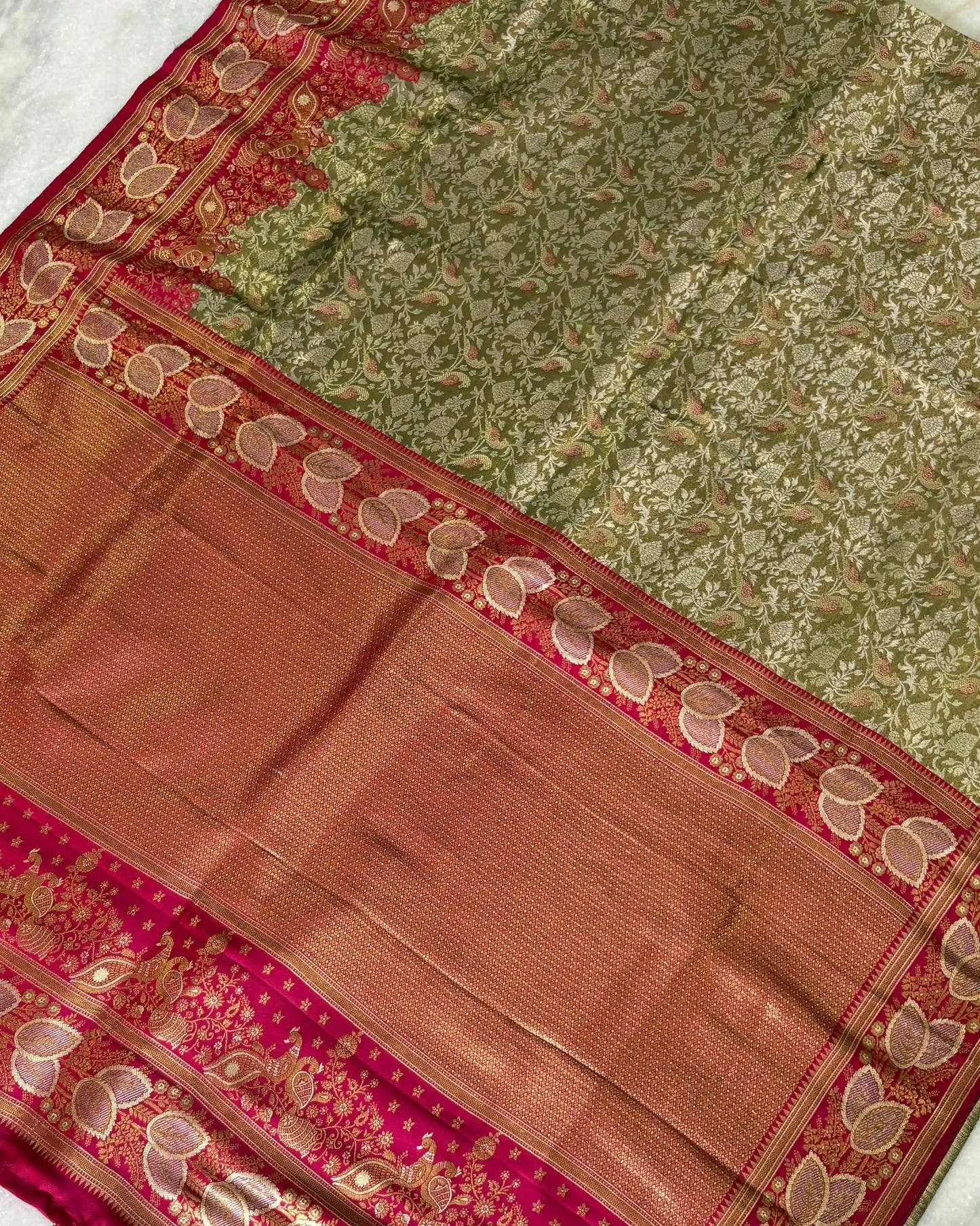Saree with green and brown patterns on a white background
