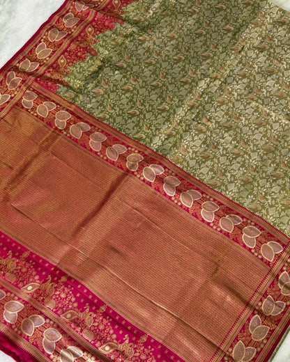 Saree with green and brown patterns on a white background