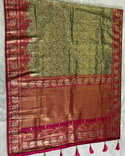 Traditional saree with green and red patterns on a white background