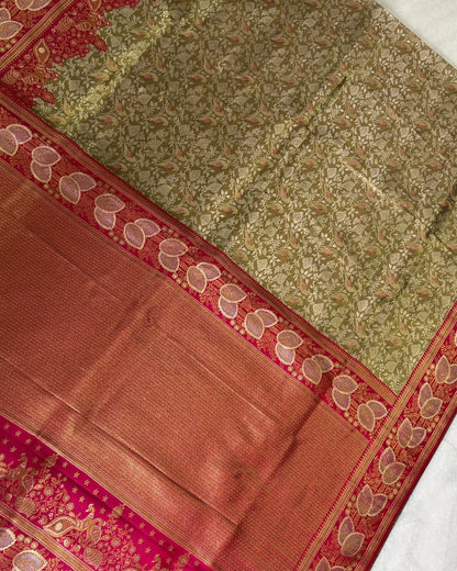 Close-up of a traditional saree with intricate patterns and colors.