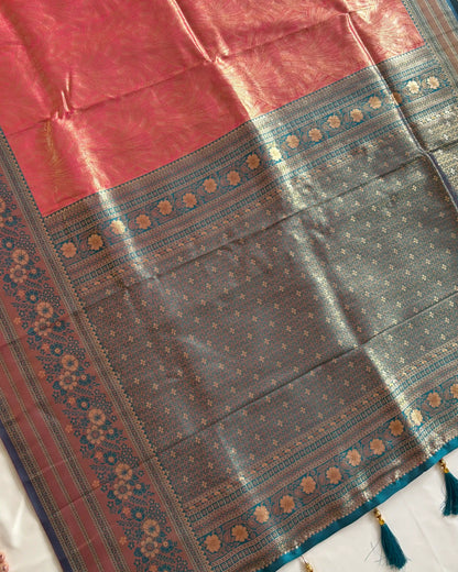 Traditional saree with a red and blue patterned border on a white background