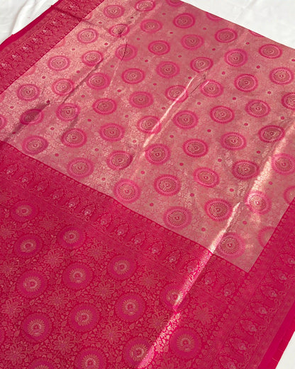Pink fabric with circular patterns on a white background