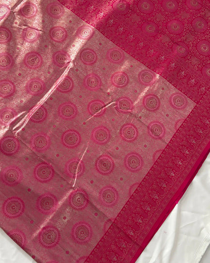 Pink fabric with circular patterns on a white background