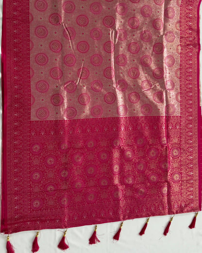 Red and pink patterned fabric with tassels on a white background