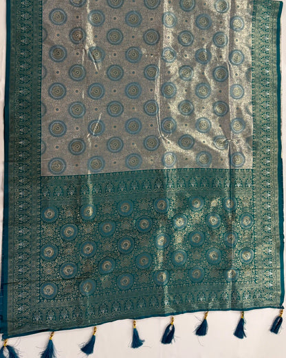 Traditional patterned fabric with tassels on a white background
